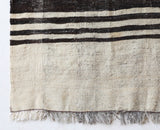Vintage kilim rug in room decor setting, old rug, antique rug, pastel colors, faded colors, Turkish rug, vintage rug, soft rug, Portland, Oregon, rug store, rug shop, local shop, antique rug