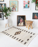 Vintage kilim rug in room decor setting, old rug, antique rug, pastel colors, faded colors, Turkish rug, vintage rug, soft rug, Portland, Oregon, rug store, rug shop, local shop, antique rug