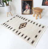 Vintage kilim rug in room decor setting, old rug, antique rug, pastel colors, faded colors, Turkish rug, vintage rug, soft rug, Portland, Oregon, rug store, rug shop, local shop, antique rug