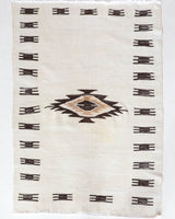 Vintage kilim rug in room decor setting, old rug, antique rug, pastel colors, faded colors, Turkish rug, vintage rug, soft rug, Portland, Oregon, rug store, rug shop, local shop, antique rug