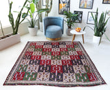 Vintage kilim rug in living room setting, bright colors, wild shaman, soft rug, bold color, Portland, Oregon, rug store, rug shop, local shop, vintage rug, modern kilim, warm colors