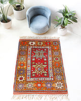 Vintage Turkish rug in a living room setting, pile rug, Turkish rug, vintage rug, portland, rug shop, bright colors, wild shaman, soft rug, bold color, Portland, Oregon, rug store, rug shop, local shop, antique rug
