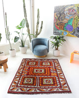 Vintage Turkish rug in a living room setting, pile rug, Turkish rug, vintage rug, portland, rug shop, bright colors, wild shaman, soft rug, bold color, Portland, Oregon, rug store, rug shop, local shop, antique rug