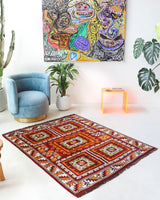 Vintage Turkish rug in a living room setting, pile rug, Turkish rug, vintage rug, portland, rug shop, bright colors, wild shaman, soft rug, bold color, Portland, Oregon, rug store, rug shop, local shop, antique rug