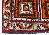 Vintage Turkish rug in a living room setting, pile rug, Turkish rug, vintage rug, portland, rug shop, bright colors, wild shaman, soft rug, bold color, Portland, Oregon, rug store, rug shop, local shop, antique rug