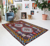 Vintage kilim rug in living room setting, bright colors, wild shaman, soft rug, bold color, Portland, Oregon, rug store, rug shop, local shop, vintage rug, modern kilim, warm colors
