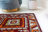 Vintage Turkish rug in a living room setting, pile rug, Turkish rug, vintage rug, portland, rug shop, bright colors, wild shaman, soft rug, bold color, Portland, Oregon, rug store, rug shop, local shop, antique rug
