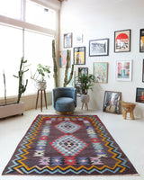 Vintage kilim rug in living room setting, bright colors, wild shaman, soft rug, bold color, Portland, Oregon, rug store, rug shop, local shop, vintage rug, modern kilim, warm colors