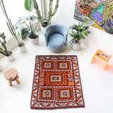 Vintage Turkish rug in a living room setting, pile rug, Turkish rug, vintage rug, portland, rug shop, bright colors, wild shaman, soft rug, bold color, Portland, Oregon, rug store, rug shop, local shop, antique rug