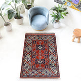 Vintage Turkish rug in a living room setting, pile rug, Turkish rug, vintage rug, portland, rug shop, bright colors, wild shaman, soft rug, bold color, Portland, Oregon, rug store, rug shop, local shop, antique rug