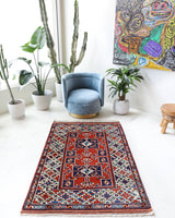 Vintage Turkish rug in a living room setting, pile rug, Turkish rug, vintage rug, portland, rug shop, bright colors, wild shaman, soft rug, bold color, Portland, Oregon, rug store, rug shop, local shop, antique rug