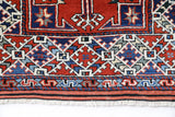Vintage Turkish rug in a living room setting, pile rug, Turkish rug, vintage rug, portland, rug shop, bright colors, wild shaman, soft rug, bold color, Portland, Oregon, rug store, rug shop, local shop, antique rug