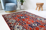Vintage Turkish rug in a living room setting, pile rug, Turkish rug, vintage rug, portland, rug shop, bright colors, wild shaman, soft rug, bold color, Portland, Oregon, rug store, rug shop, local shop, antique rug