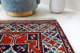 Vintage Turkish rug in a living room setting, pile rug, Turkish rug, vintage rug, portland, rug shop, bright colors, wild shaman, soft rug, bold color, Portland, Oregon, rug store, rug shop, local shop, antique rug