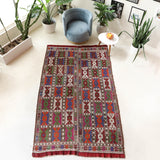 Vintage kilim rug in living room setting, bright colors, wild shaman, soft rug, bold color, Portland, Oregon, rug store, rug shop, local shop, vintage rug, modern kilim, warm colors