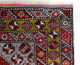 Vintage Turkish rug in living room setting, old rug, antique rug, pastel colors, faded colors, Turkish rug, vintage rug, soft rug, Portland, Oregon, rug store, rug shop, local shop