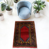 Vintage Turkish rug in a living room setting, pile rug, Turkish rug, vintage rug, portland, rug shop, bright colors, wild shaman, soft rug, bold color, Portland, Oregon, rug store, rug shop, local shop, antique rug