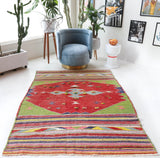 Vintage kilim rug in living room setting, bright colors, wild shaman, soft rug, bold color, Portland, Oregon, rug store, rug shop, local shop, vintage rug, modern kilim, warm colors