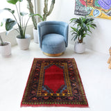 Vintage Turkish rug in a living room setting, pile rug, Turkish rug, vintage rug, portland, rug shop, bright colors, wild shaman, soft rug, bold color, Portland, Oregon, rug store, rug shop, local shop, antique rug