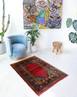 Vintage Turkish rug in a living room setting, pile rug, Turkish rug, vintage rug, portland, rug shop, bright colors, wild shaman, soft rug, bold color, Portland, Oregon, rug store, rug shop, local shop, antique rug