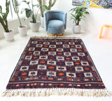 Vintage kilim rug in living room setting, bright colors, wild shaman, soft rug, bold color, Portland, Oregon, rug store, rug shop, local shop, vintage rug, modern kilim, warm colors, antique kilim rug