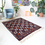 Vintage kilim rug in living room setting, bright colors, wild shaman, soft rug, bold color, Portland, Oregon, rug store, rug shop, local shop, vintage rug, modern kilim, warm colors, antique kilim rug