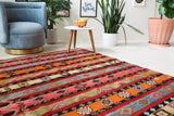 Vintage kilim rug in living room setting, bright colors, wild shaman, soft rug, bold color, Portland, Oregon, rug store, rug shop, local shop, vintage rug, modern kilim, warm colors