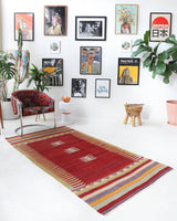 Vintage kilim rug in living room setting, old rug, antique rug, pastel colors, faded colors, Turkish rug, vintage rug, soft rug, Portland, Oregon, rug store, rug shop, local shop, earthy tones, earthy colors, warm colors