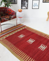 Vintage kilim rug in living room setting, old rug, antique rug, pastel colors, faded colors, Turkish rug, vintage rug, soft rug, Portland, Oregon, rug store, rug shop, local shop, earthy tones, earthy colors, warm colors