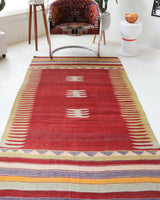 Vintage kilim rug in living room setting, old rug, antique rug, pastel colors, faded colors, Turkish rug, vintage rug, soft rug, Portland, Oregon, rug store, rug shop, local shop, earthy tones, earthy colors, warm colors