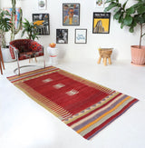 Vintage kilim rug in living room setting, old rug, antique rug, pastel colors, faded colors, Turkish rug, vintage rug, soft rug, Portland, Oregon, rug store, rug shop, local shop, earthy tones, earthy colors, warm colors