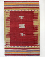 Vintage kilim rug in living room setting, old rug, antique rug, pastel colors, faded colors, Turkish rug, vintage rug, soft rug, Portland, Oregon, rug store, rug shop, local shop, earthy tones, earthy colors, warm colors