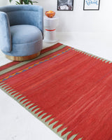 Vintage kilim rug in room decor setting, old rug, antique rug, pastel colors, faded colors, Turkish rug, vintage rug, soft rug, Portland, Oregon, rug store, rug shop, local shop, bold colors, bright colors, faded colors