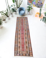 Vintage Turkish runner rug in living room setting, old rug, antique rug, pastel colors, faded colors, Turkish rug, vintage rug, soft rug, Portland, Oregon, rug store, rug shop, local shop