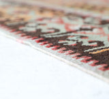 Vintage Turkish runner rug in living room setting, old rug, antique rug, pastel colors, faded colors, Turkish rug, vintage rug, soft rug, Portland, Oregon, rug store, rug shop, local shop