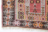 Vintage Turkish runner rug in living room setting, old rug, antique rug, pastel colors, faded colors, Turkish rug, vintage rug, soft rug, Portland, Oregon, rug store, rug shop, local shop