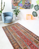 Vintage Turkish runner rug in living room setting, old rug, antique rug, pastel colors, faded colors, Turkish rug, vintage rug, soft rug, Portland, Oregon, rug store, rug shop, local shop