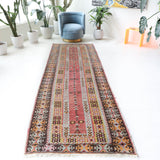 Vintage Turkish runner rug in living room setting, old rug, antique rug, pastel colors, faded colors, Turkish rug, vintage rug, soft rug, Portland, Oregon, rug store, rug shop, local shop