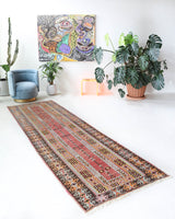 Vintage Turkish runner rug in living room setting, old rug, antique rug, pastel colors, faded colors, Turkish rug, vintage rug, soft rug, Portland, Oregon, rug store, rug shop, local shop