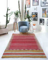 Vintage kilim rug in living room setting, old rug, antique rug, pastel colors, faded colors, Turkish rug, vintage rug, soft rug, Portland, Oregon, rug store, rug shop, local shop, earthy tones, earthy colors, warm colors