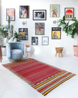 Vintage kilim rug in living room setting, old rug, antique rug, pastel colors, faded colors, Turkish rug, vintage rug, soft rug, Portland, Oregon, rug store, rug shop, local shop, earthy tones, earthy colors, warm colors