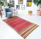 Vintage kilim rug in living room setting, old rug, antique rug, pastel colors, faded colors, Turkish rug, vintage rug, soft rug, Portland, Oregon, rug store, rug shop, local shop, earthy tones, earthy colors, warm colors