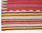 Vintage kilim rug in living room setting, old rug, antique rug, pastel colors, faded colors, Turkish rug, vintage rug, soft rug, Portland, Oregon, rug store, rug shop, local shop, earthy tones, earthy colors, warm colors