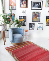 Vintage kilim rug in living room setting, old rug, antique rug, pastel colors, faded colors, Turkish rug, vintage rug, soft rug, Portland, Oregon, rug store, rug shop, local shop, earthy tones, earthy colors, warm colors