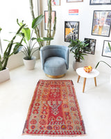 Vintage kilim rug in living room setting, old rug, antique rug, pastel colors, faded colors, Turkish rug, vintage rug, soft rug, Portland, Oregon, rug store, rug shop, local shop, earthy tones, earthy colors, warm colors