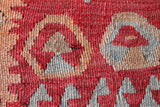 Vintage kilim rug in living room setting, old rug, antique rug, pastel colors, faded colors, Turkish rug, vintage rug, soft rug, Portland, Oregon, rug store, rug shop, local shop, earthy tones, earthy colors, warm colors