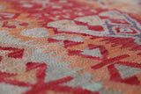 Vintage kilim rug in living room setting, old rug, antique rug, pastel colors, faded colors, Turkish rug, vintage rug, soft rug, Portland, Oregon, rug store, rug shop, local shop, earthy tones, earthy colors, warm colors