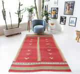Vintage kilim rug in living room setting, old rug, antique rug, pastel colors, faded colors, Turkish rug, vintage rug, soft rug, Portland, Oregon, rug store, rug shop, local shop, earthy tones, earthy colors, warm colors
