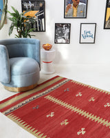 Vintage kilim rug in living room setting, old rug, antique rug, pastel colors, faded colors, Turkish rug, vintage rug, soft rug, Portland, Oregon, rug store, rug shop, local shop, earthy tones, earthy colors, warm colors