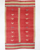 Vintage kilim rug in living room setting, old rug, antique rug, pastel colors, faded colors, Turkish rug, vintage rug, soft rug, Portland, Oregon, rug store, rug shop, local shop, earthy tones, earthy colors, warm colors